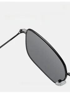 Macro detail of high-quality metal hinge on vintage square black sunglasses frame
