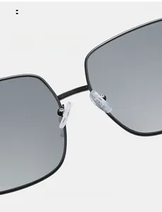 Macro detail of soft silicone nose pads on square metal frame sunglasses
