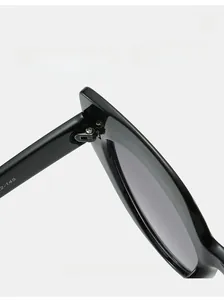 Close-up of durable metal hinge and size specifications on black oversized sunglasses