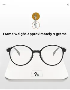 Black round frame glasses on a digital scale showing an ultra-lightweight of 9 grams