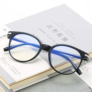 Retro black full-frame anti-blue light glasses on books for a vintage aesthetic look