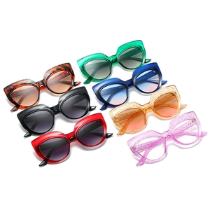 Multiple colors of vintage cat eye sunglasses with stylish rice nail metal rivet accents