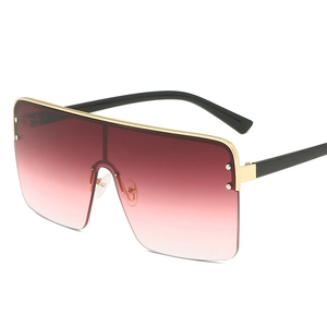 Oversized gradient red rimless sunglasses with gold top bar and stud accents