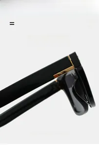 Detail of high-elasticity hinge and golden rectangle decor on black square sunglasses