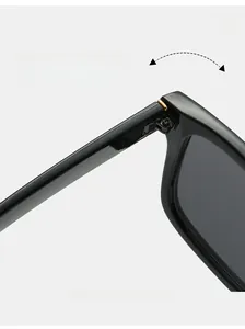 Macro shot of high-quality metal hinge construction on vintage black square sunglasses