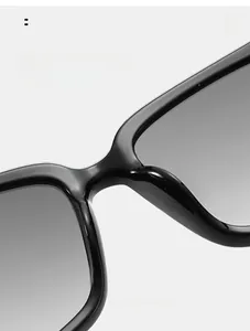 Detail of ergonomic integrated nose pads on irregular black sunglasses for comfort