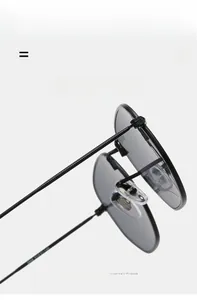 Detailed side view of black metal sunglasses featuring textured temples and silicone nose pads