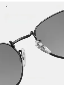 Detail of soft silicone nose pads on black metal frame sunglasses for comfortable wear