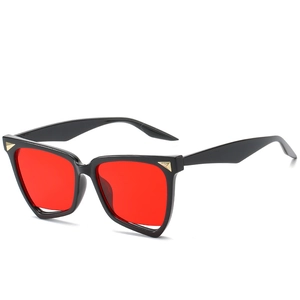 Fashion irregular black sunglasses with bold red lenses and gold triangle accents