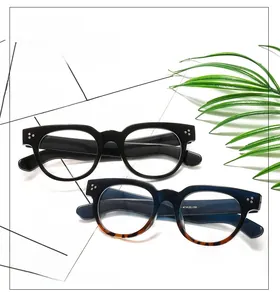 Detail of vintage round eyewear frames with dual rivets and blue tortoiseshell gradient