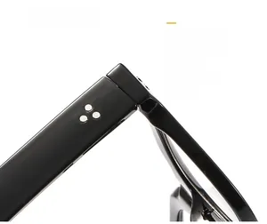 Macro detail of retro round glasses frame showing silver rivets and hinge craftsmanship