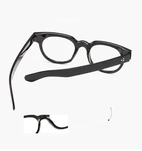 Detail of self-adjusting non-pressure nasal support on vintage round black glasses frame