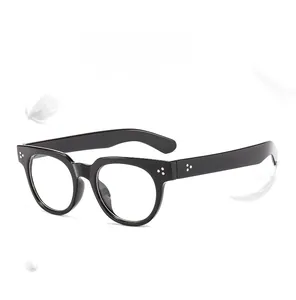 Detail of lightweight retro round black frame glasses with floating feathers for comfort