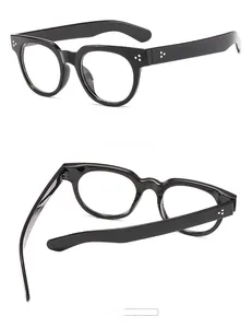 Detail view of vintage round black frames with triple metal rivets and inner temple coding