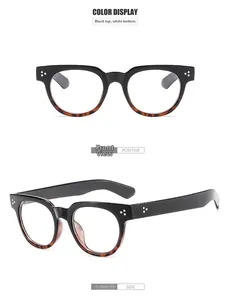 Detail view of vintage round eyeglasses in black and tortoiseshell finish