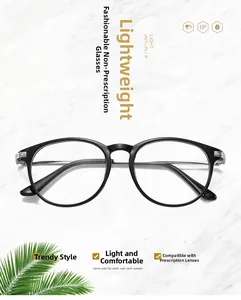 Detail view of lightweight black round glasses frames with metallic accents on marble