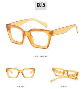 Vue détaillée de lunettes de soleil carrées orange rétro avec rivets métalliques sur la monture