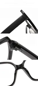 Detail of metal hinges, ergonomic nose pads, and thick black frame temples for glasses