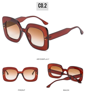 Vue triple des lunettes de soleil carrées épaisses avec monture brun-rouge et rivets