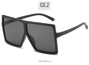 Side view of oversized square frame sunglasses in matte black with 45-degree angle display