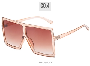 Detail view of pink square sunglasses with gradient lenses and slim temples at 45 degree angle