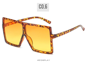 45-degree angle display of tortoise square oversized sunglasses with orange gradient lenses