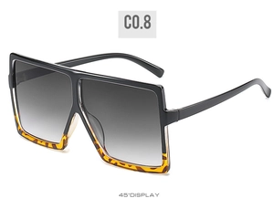 Detail view of square oversized sunglasses with black and tortoise shell frame design