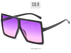 Detail view showing a 45-degree angle of large square sunglasses with purple gradient lenses