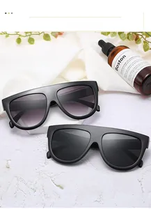 Flat top square sunglasses with black frames and gradient purple lenses on silk