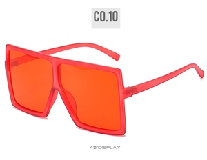 Detail view of bold square frame sunglasses in matte red finish and tinted lenses