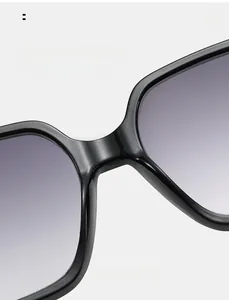 Detail of comfortable integrated nose pads on black square frame sunglasses with purple lenses