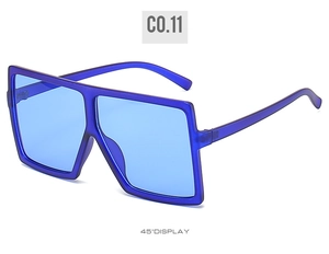 Detail view of large blue transparent square frame sunglasses at a 45-degree angle