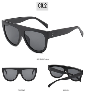Flat top matte black sunglasses featuring silver triple-rivet detail and grey lenses