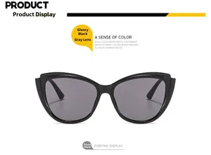 Front view of cat-eye sunglasses featuring glossy black frames and dark grey lenses