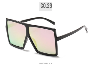 Detailed 45-degree view of oversized square sunglasses with colorful gradient mirror lenses