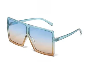 Detail view of square sunglasses with blue-orange gradient lenses and green frame