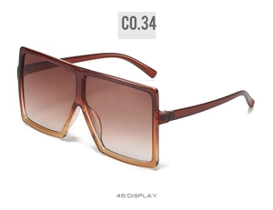 Detailed 45-degree angle view of oversized square sunglasses in translucent brown frame