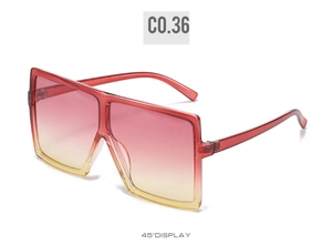 45-degree side view of oversized square sunglasses with pink yellow gradient lenses