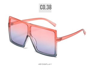 Detailed 45-degree side view of oversized transparent orange square frame sunglasses