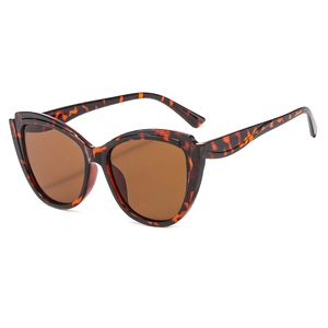 Retro oversized cat-eye sunglasses with tortoise frame and dark brown lenses