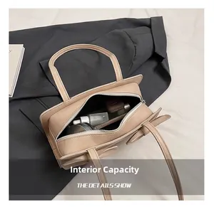 Top view of beige handbag interior showing spacious capacity for phone and cosmetics
