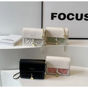 Selection of woven crossbody bags with metal chains and fashion typography text