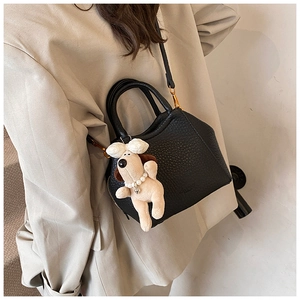 Litchi texture leather handbag in black with cute plush dog charm detail