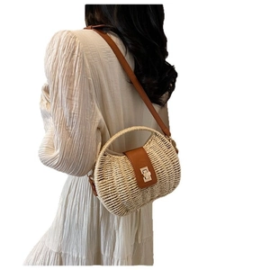 Chic beige straw shoulder bag with brown leather strap and gold buckle for vacation
