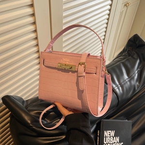 Pink crocodile pattern handbag with gold lock and adjustable shoulder strap for women