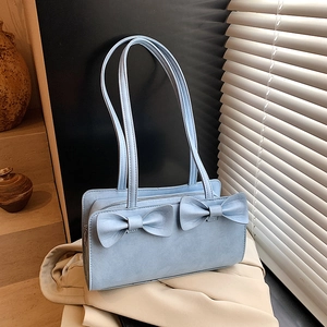 Light blue faux leather handbag with double bows and adjustable shoulder strap for women