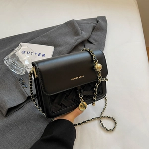Fashionable black leather crossbody bag with woven texture and gold chain strap