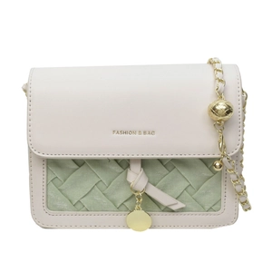 Chic color-block shoulder bag in cream and mint green with gold chain and sphere detail