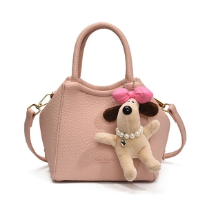 Pink lychee texture leather shoulder bag with plush puppy pendant and brand logo