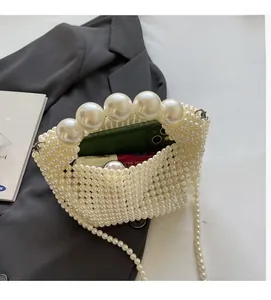 Macro shot of handcrafted pearl tote bag interior showing ample storage for phone and makeup